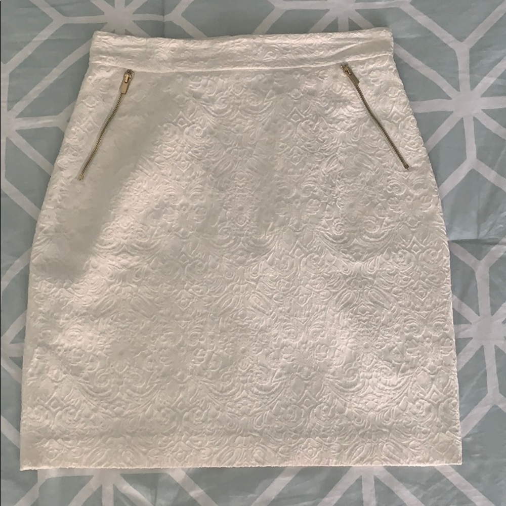 White, above knee skirt with gold embellishments
